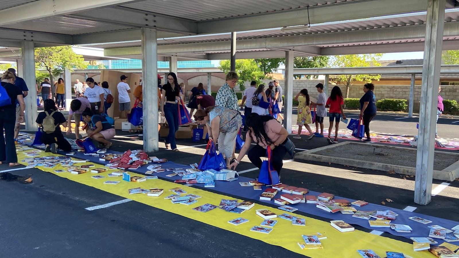 Parents and students perusing books